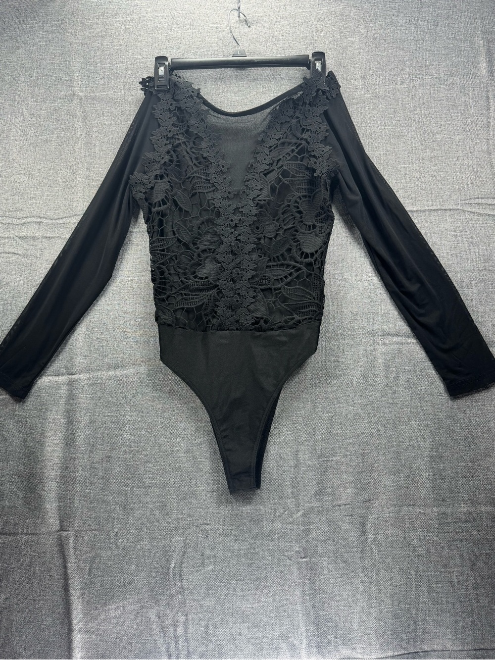 Woman’s Black Lace Long-Sleeve One-Piece Bodysuit